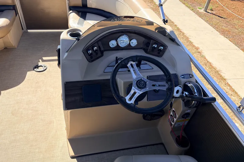 Slide: The Image of 2019 Crestliner 200 Rally CS boat dashboard with steering wheel and gauges. - 11