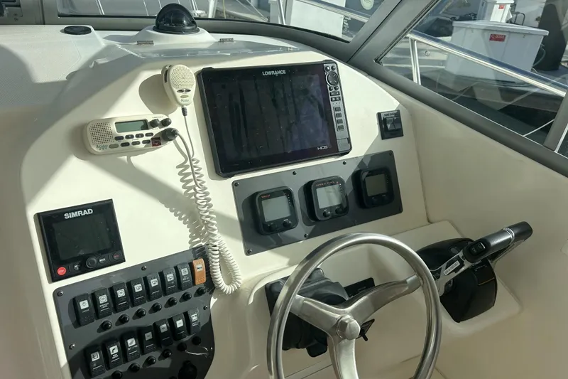 Slide: The Image of 2009 Seaswirl Striper 2901 Walkaround O/B helm with navigation and control systems. - 1