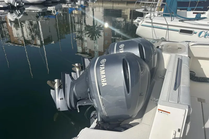 Slide: The Image of 2009 Seaswirl Striper 2901 Walkaround with dual Yamaha outboard motors docked in marina. - 2