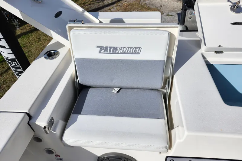 Slide: The Image of 2022 Pathfinder 2400 TRS boat seat with logo, white and gray upholstery. - 12