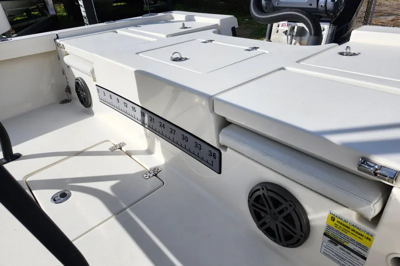 Slide: The Image of 2022 Pathfinder 2400 TRS boat interior with measuring ruler and speaker. - 17