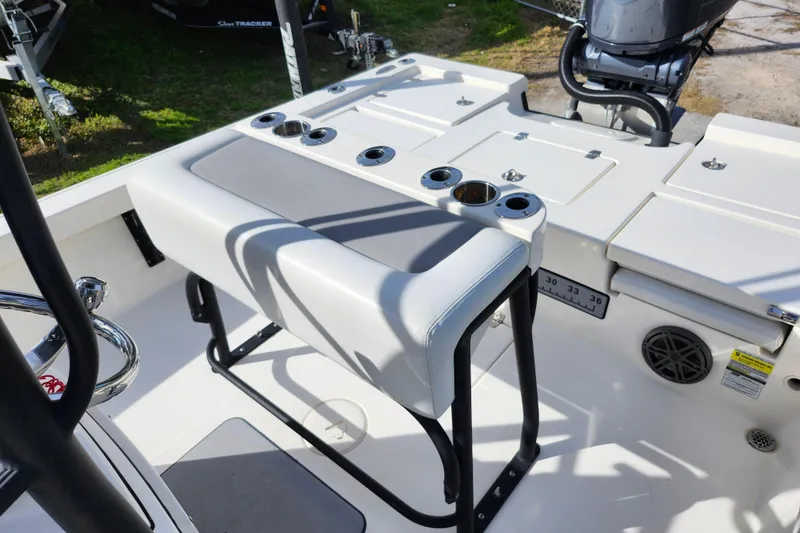 Slide: The Image of 2022 Pathfinder 2400 TRS boat interior with seating and rod holders. - 19