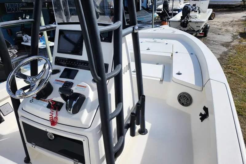 Slide: The Image of 2022 Pathfinder 2400 TRS boat interior with steering console and navigation equipment. - 24