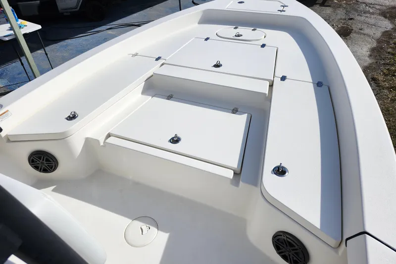 Slide: The Image of 2022 Pathfinder 2400 TRS boat deck with storage compartments and speakers. - 25