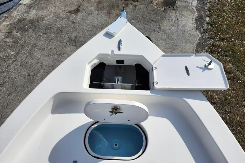 Slide: The Image of 2022 Pathfinder 2400 TRS boat deck with open storage compartments. - 28