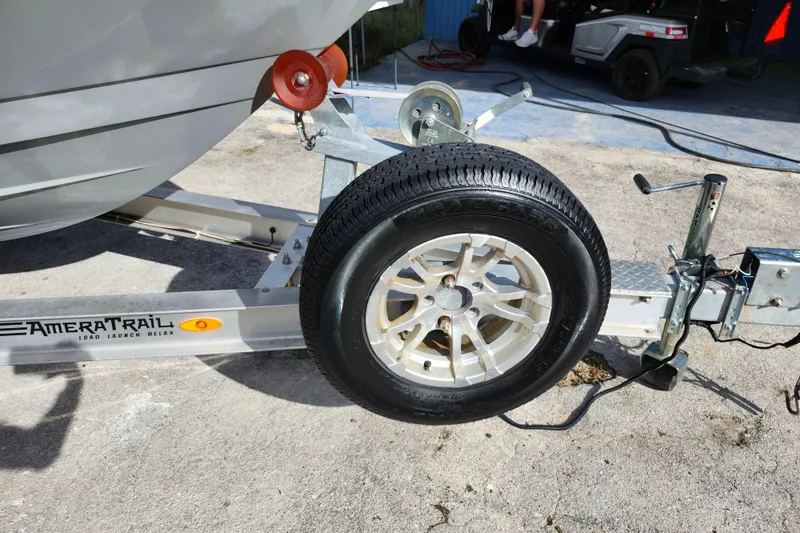 Slide: The Image of Trailer with spare tire for 2022 Pathfinder 2400 TRS boat, AmeraTrail branding visible. - 35