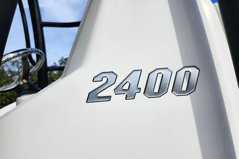 Slide: The Image of Close-up of 2022 Pathfinder 2400 TRS model emblem on white surface. - 38