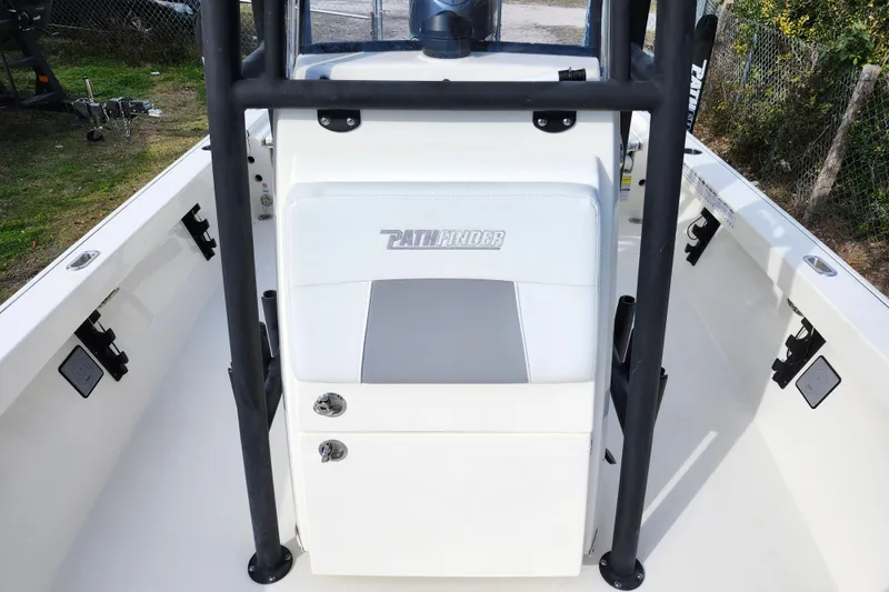 Slide: The Image of 2022 Pathfinder 2400 TRS boat interior with seating and console, showcasing sleek design. - 39