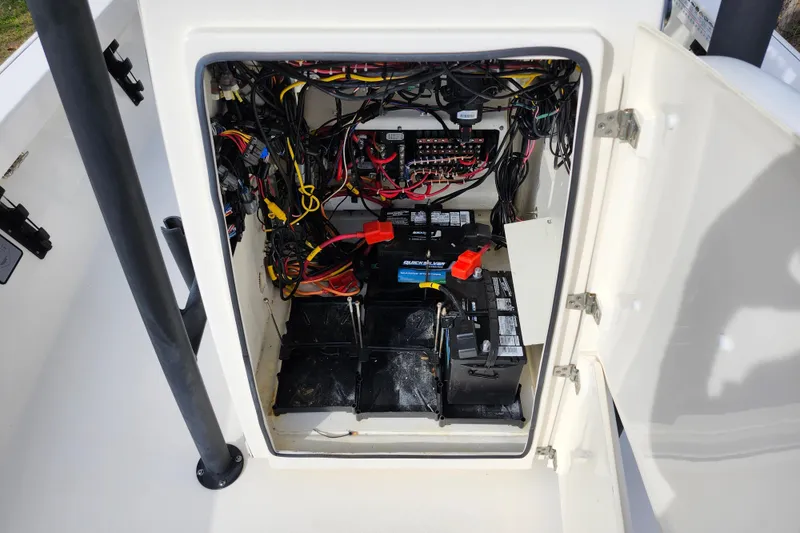 Slide: The Image of 2022 Pathfinder 2400 TRS boat battery compartment with wiring and connections. - 40