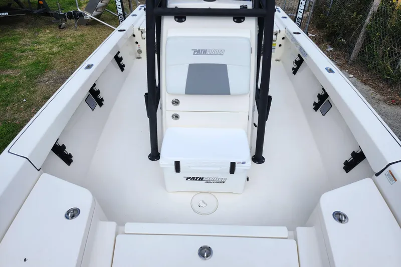 Slide: The Image of 2022 Pathfinder 2400 TRS boat interior with seating and storage compartments. - 42