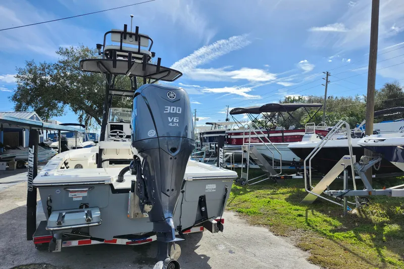 Slide: The Image of 2022 Pathfinder 2400 TRS boat with Yamaha 300 V6 engine in a marina setting. - 5