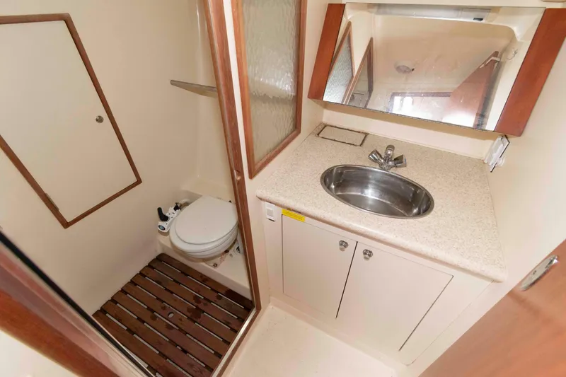Slide: The Image of 2009 Hunter 36 yacht bathroom with sink, mirror, and toilet. - 13