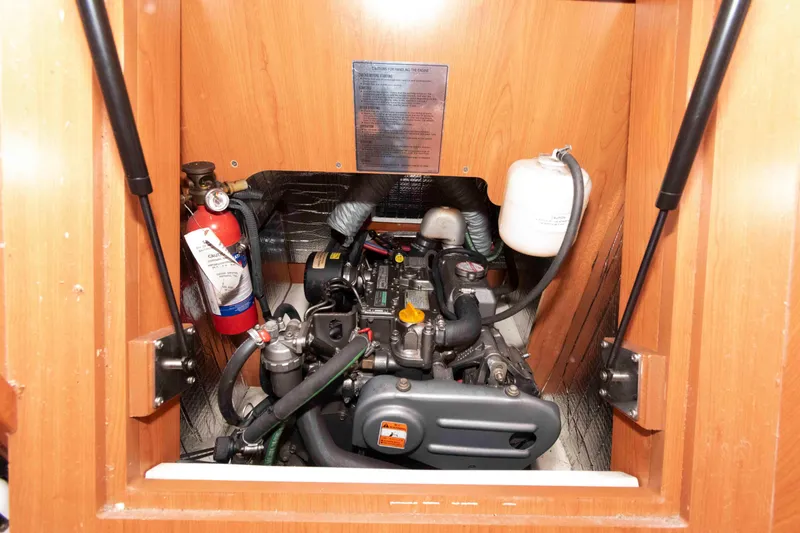 Slide: The Image of Engine compartment of a 2009 Hunter 36 sailboat with fire extinguisher. - 14
