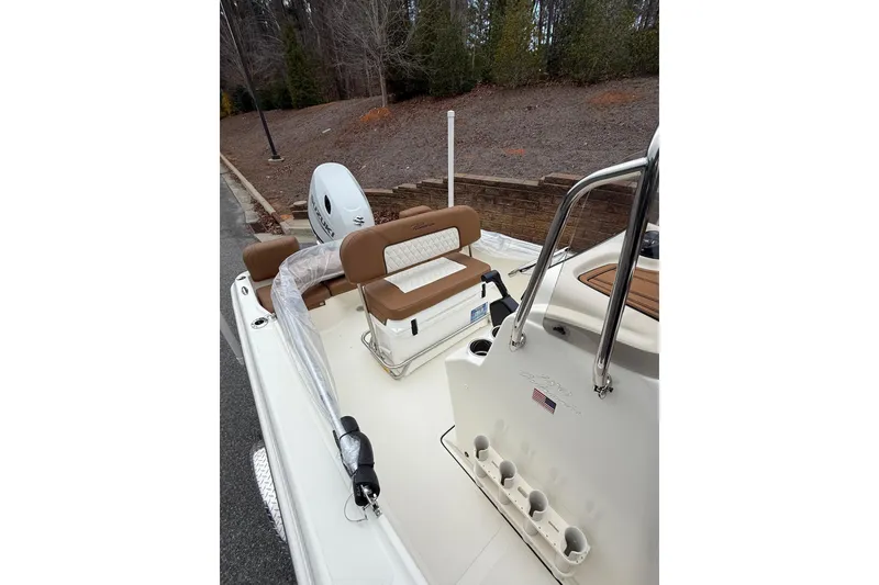 Slide: The Image of 2026 Pioneer 180 Islander boat interior with seating and rod holders. - 6