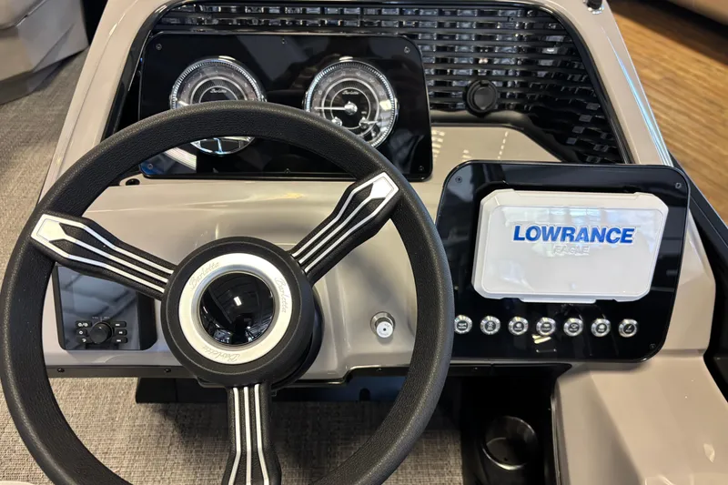 Slide: The Image of Steering console of 2026 Barletta ARIA 22UC with Lowrance display and gauges. - 10