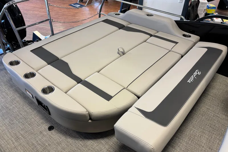 Slide: The Image of 2026 Barletta ARIA 22UC boat interior with beige seating and cup holders. - 15