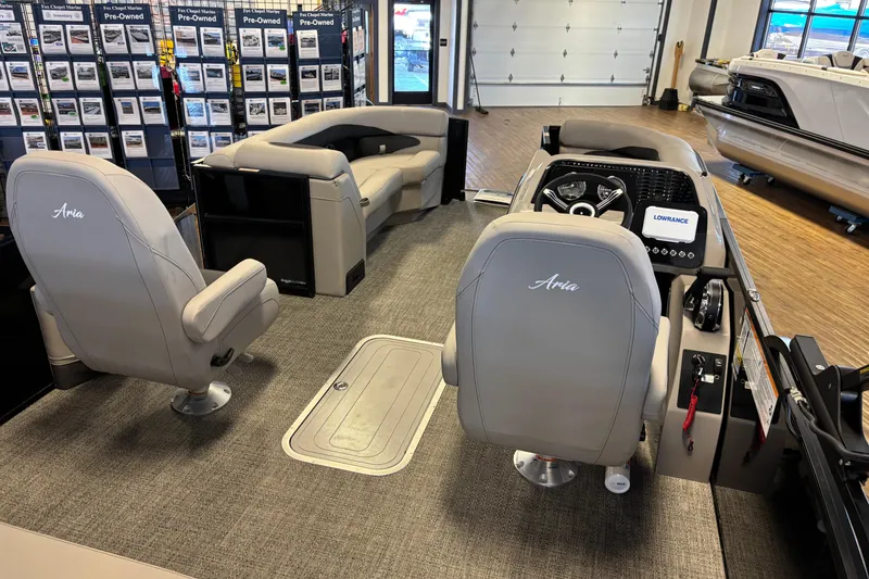 Slide: The Image of Interior of 2026 Barletta ARIA 22UC boat with plush seating and modern dashboard. - 8