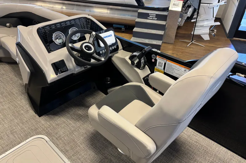 Slide: The Image of 2026 Barletta ARIA 22UC boat interior with modern steering console and comfortable seating. - 9