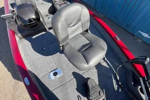 Slide: The Image of 2023 Tracker Pro Team 175 TF boat interior with gray seating and red accents. - 10