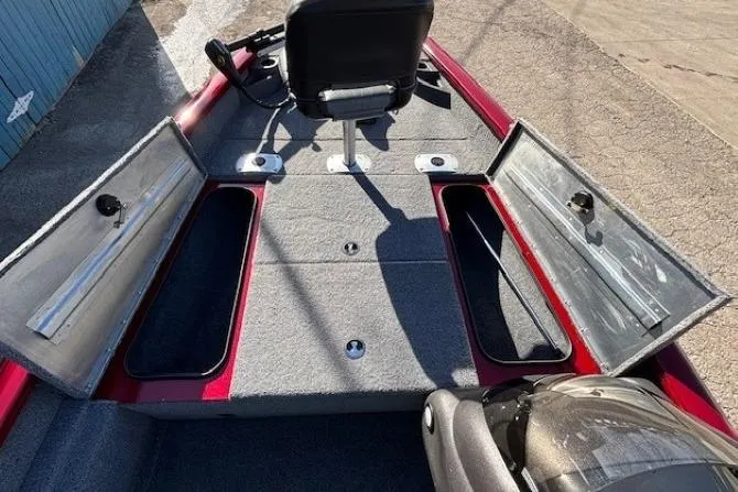 Slide: The Image of 2023 Tracker Pro Team 175 TF boat interior with open storage compartments. - 11