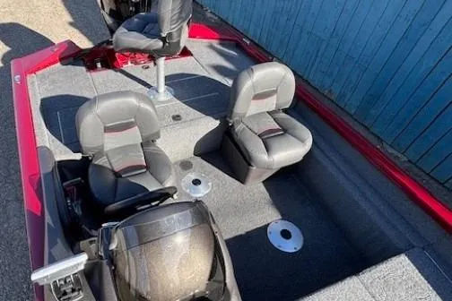 Slide: The Image of 2023 Tracker Pro Team 175 TF boat interior with seating and steering console. - 15