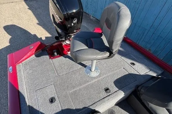 Slide: The Image of 2023 Tracker Pro Team 175 TF boat with seating and motor, red and gray design. - 21