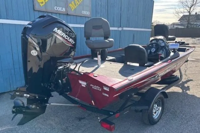 Slide: The Image of 2023 Tracker Pro Team 175 TF boat with Mercury engine, parked outdoors. - 3