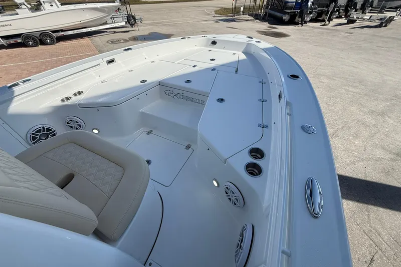 Slide: The Image of 2026 Crevalle 24 HCO boat interior with seating and storage compartments. - 25