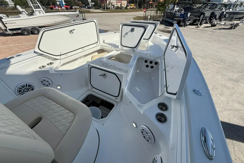 Slide: The Image of 2026 Crevalle 24 HCO boat interior with open storage compartments and seating. - 26
