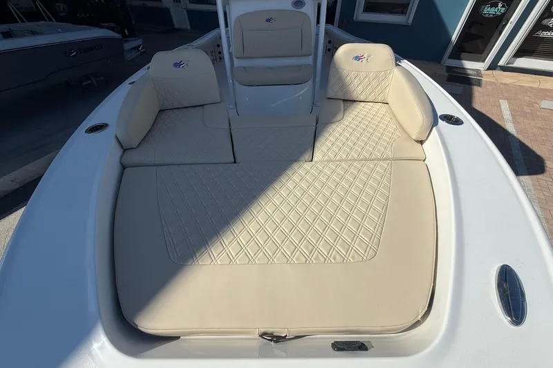 Slide: The Image of Luxurious seating on 2026 Crevalle 24 HCO boat with diamond-stitched upholstery. - 29
