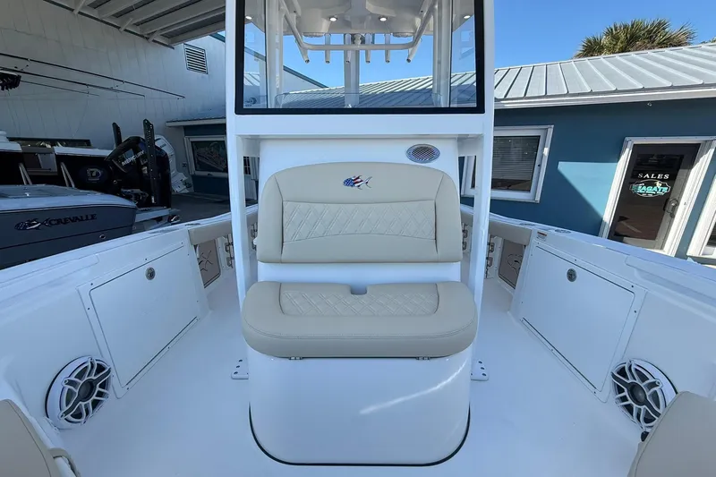 Slide: The Image of 2026 Crevalle 24 HCO boat interior with beige seating and modern design. - 32