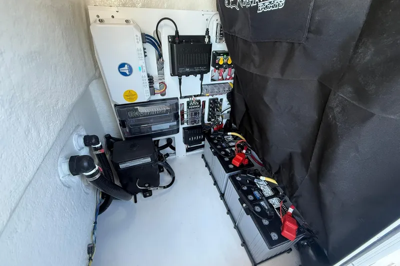 Slide: The Image of Electrical system of a 2026 Crevalle 24 HCO boat, featuring batteries and wiring components. - 21