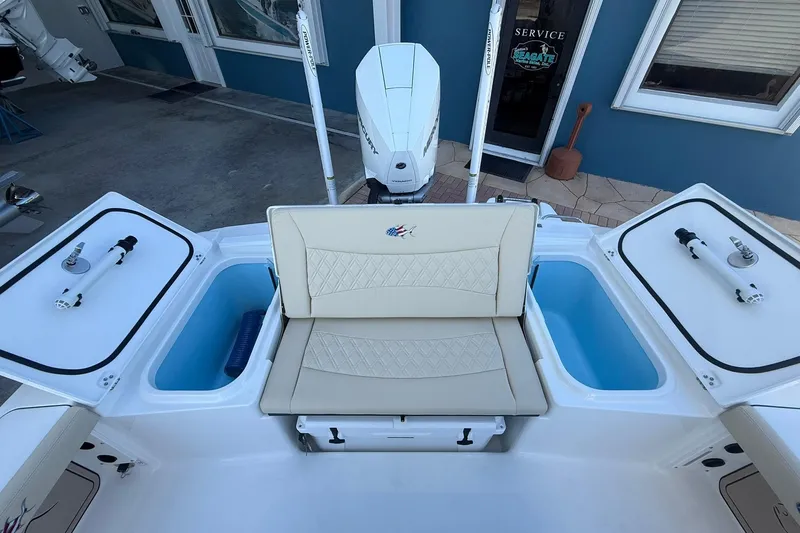 Slide: The Image of 2026 Crevalle 24 HCO boat interior with seating and storage compartments. - 8