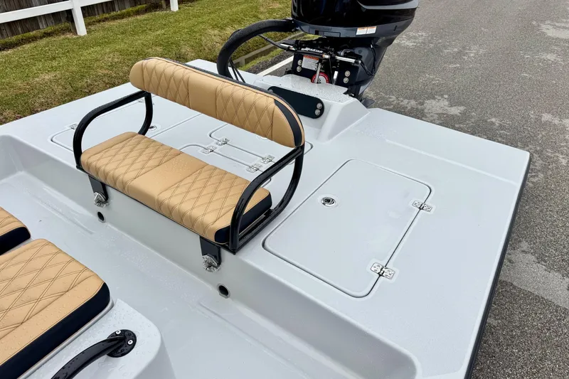Slide: The Image of 2026 SCB R24 boat with tan quilted seating and rear motor. - 9