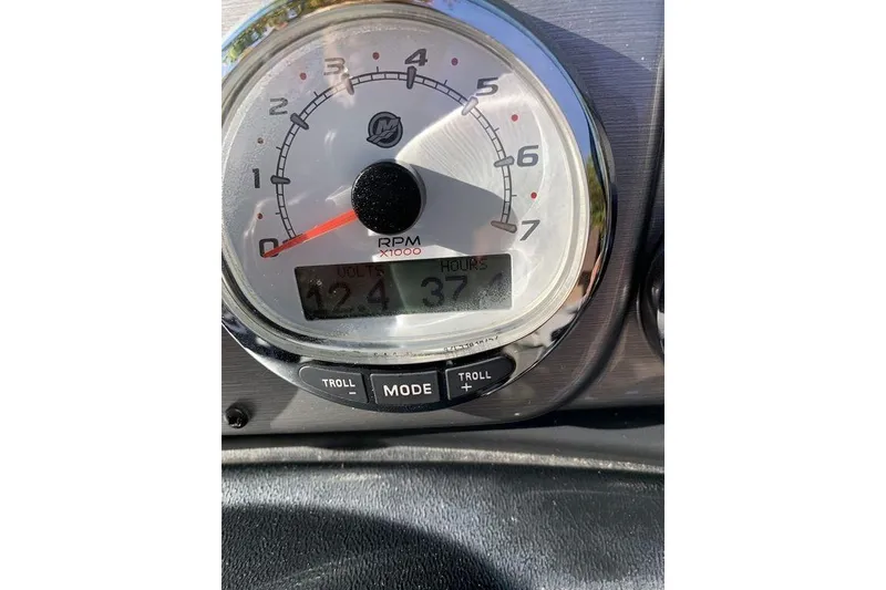 Slide: The Image of Close-up of a 2022 Lund 1875 Pro-V Sport tachometer displaying RPM and voltage. - 7