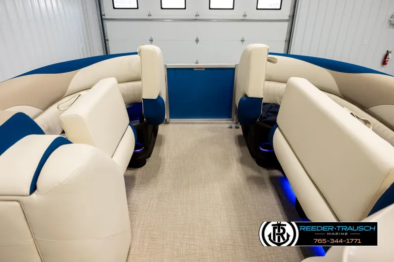 Slide: The Image of Luxurious interior of 2026 Avalon LSZ ENT pontoon boat with plush seating and ambient lighting. - 19
