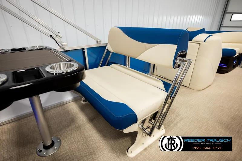 Slide: The Image of 2026 Avalon LSZ ENT boat interior with blue and white seating and table. - 25