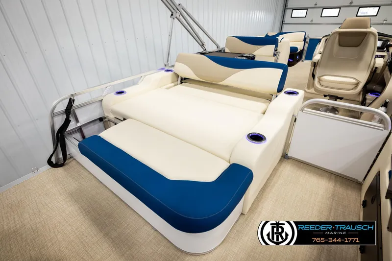 Slide: The Image of Luxurious interior of 2026 Avalon LSZ ENT pontoon boat with plush seating and cup holders. - 31