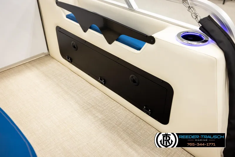 Slide: The Image of 2026 Avalon LSZ ENT boat interior with storage compartment and cup holder. - 32