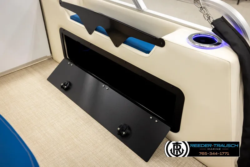 Slide: The Image of 2026 Avalon LSZ ENT boat interior with storage compartment and illuminated cup holder. - 33