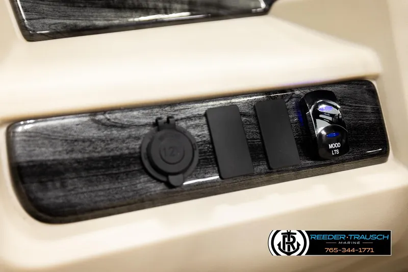 Slide: The Image of Control panel of 2026 Avalon LSZ ENT with mood lighting switch and 12V outlet. - 37