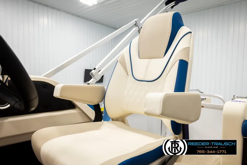 Slide: The Image of 2026 Avalon LSZ ENT boat seat with beige and blue design in showroom. - 44