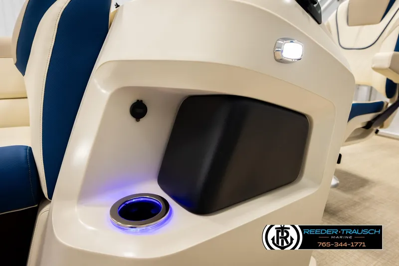 Slide: The Image of 2026 Avalon LSZ ENT boat interior with illuminated cup holder and seating. - 49