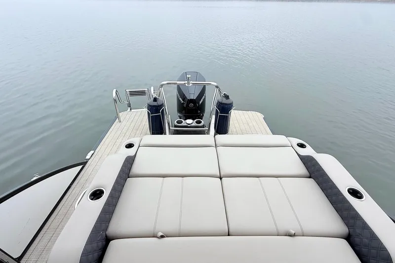 Slide: The Image of 2020 Barletta L23UC pontoon boat with spacious rear deck and comfortable seating. - 14