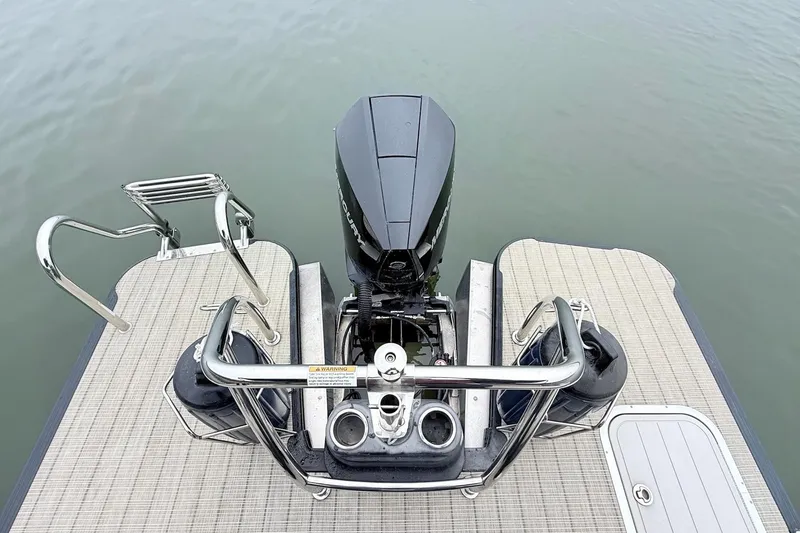 Slide: The Image of 2020 Barletta L23UC boat stern with motor, swim platform, and stainless steel railings. - 19