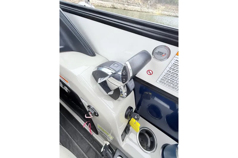 Slide: The Image of Throttle control panel of 2020 Barletta L23UC boat, featuring sleek design and safety instructions. - 20
