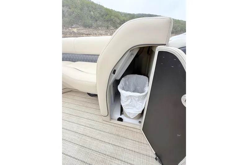 Slide: The Image of Barletta L23UC 2020 boat interior with hidden trash compartment under seat. - 21