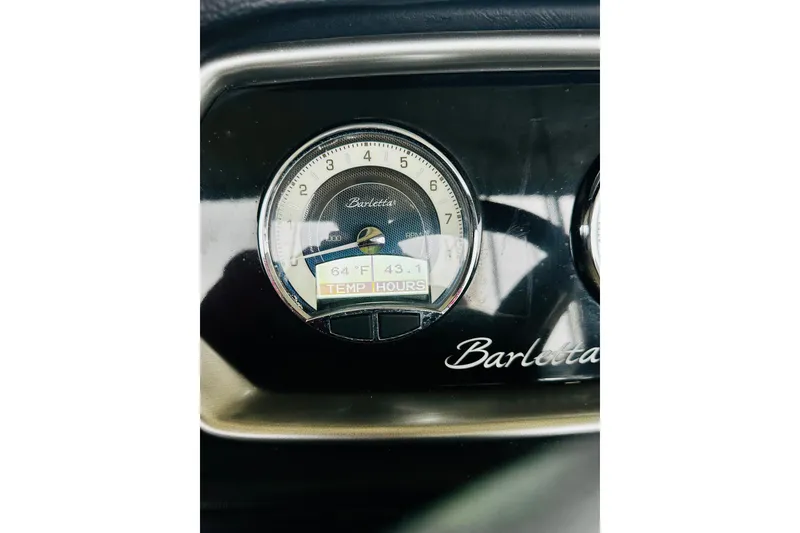 Slide: The Image of Close-up of 2020 Barletta L23UC gauge displaying temperature and hours. - 26