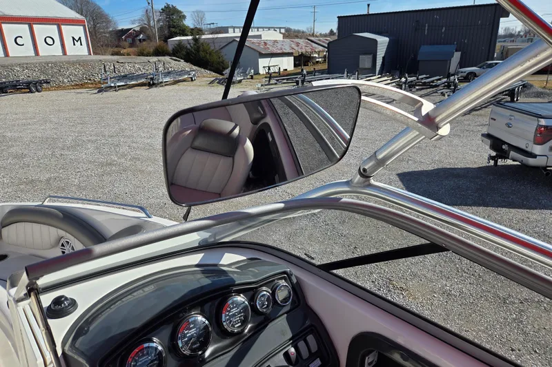 Slide: The Image of 2008 Yamaha Boats AR230 HO dashboard and rearview mirror in a parking lot setting. - 16