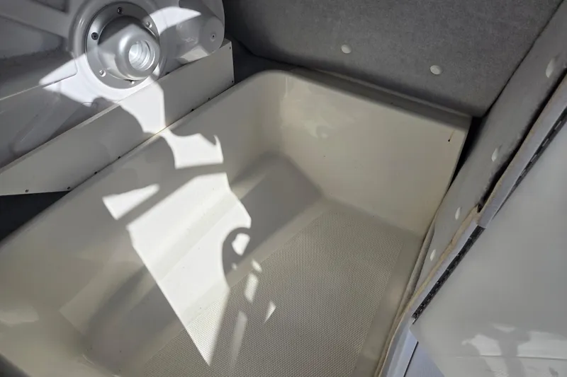 Slide: The Image of 2008 Yamaha Boats AR230 HO interior storage compartment with textured flooring. - 17